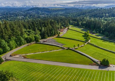 Willamette National Cemetary aerial view of large well maintained lawns surrounded by forest